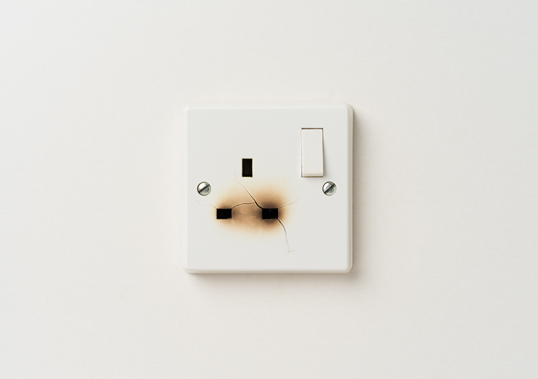 Image of a burnt out plug socket