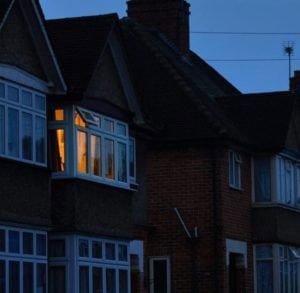 A house in the evening with a light on